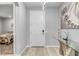 Entryway with light wood floors, modern art, and views to the bedroom at 2391 Dalewood Ave, North Las Vegas, NV 89086