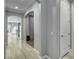 Bright hallway with archway, light wood floors, and access to multiple rooms at 2391 Dalewood Ave, North Las Vegas, NV 89086