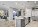 Open kitchen featuring a large island with seating and stainless steel appliances at 2391 Dalewood Ave, North Las Vegas, NV 89086