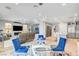 Spacious open-concept living area with a dining area and a kitchen featuring an island at 2391 Dalewood Ave, North Las Vegas, NV 89086