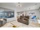Spacious living room featuring modern decor and an open floor plan with natural light at 2391 Dalewood Ave, North Las Vegas, NV 89086