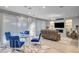 Open concept living and dining area with modern decor and hardwood floors at 2391 Dalewood Ave, North Las Vegas, NV 89086