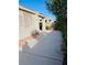 Backyard featuring an expansive concrete patio with a partial brick border at 5048 Orchid Springs St, Las Vegas, NV 89148