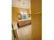 Bright bathroom offering dual sinks, a large mirror, a soaking tub, and neutral tile flooring at 5048 Orchid Springs St, Las Vegas, NV 89148