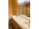 Double vanity bathroom featuring a full mirror and neutral countertops and cabinets at 5048 Orchid Springs St, Las Vegas, NV 89148