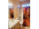 Standard bathroom with a shower-tub combo with a scenic shower curtain at 5048 Orchid Springs St, Las Vegas, NV 89148