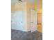 Well-lit bedroom showcasing double sliding door closet, neutral walls and carpet flooring at 5048 Orchid Springs St, Las Vegas, NV 89148