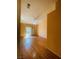 Sunlit bedroom with hardwood floors and sliding glass doors to the outside at 5048 Orchid Springs St, Las Vegas, NV 89148