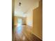Spacious bedroom featuring hardwood floors, sliding glass door to back yard, and ample natural light at 5048 Orchid Springs St, Las Vegas, NV 89148