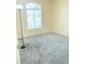 Cozy bedroom with gray carpeting and a large window for natural light at 5048 Orchid Springs St, Las Vegas, NV 89148