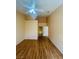 Spacious bedroom featuring hardwood floors, a ceiling fan, and access to the bathroom at 5048 Orchid Springs St, Las Vegas, NV 89148