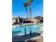 Community pool area with well maintained outdoor landscaping in a gated community at 5048 Orchid Springs St, Las Vegas, NV 89148
