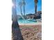 Relax at the community pool with desert landscaping and a covered seating area at 5048 Orchid Springs St, Las Vegas, NV 89148
