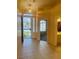 Bright foyer with tiled flooring and security screen on the front door at 5048 Orchid Springs St, Las Vegas, NV 89148