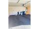 Spacious garage with painted walls and ceiling mounted garage door opener at 5048 Orchid Springs St, Las Vegas, NV 89148