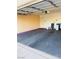 View of a spacious two-car garage featuring an automatic door system and painted interior at 5048 Orchid Springs St, Las Vegas, NV 89148