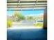 View from the garage with a suburban street and other homes in the background at 5048 Orchid Springs St, Las Vegas, NV 89148