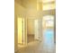 Hallway showing an open floor plan with tiled floors and access to other rooms in the home at 5048 Orchid Springs St, Las Vegas, NV 89148