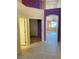 Bright hallway featuring tile flooring and neutral-colored walls at 5048 Orchid Springs St, Las Vegas, NV 89148