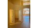 Open hallway with tiled flooring leading to multiple rooms and living spaces at 5048 Orchid Springs St, Las Vegas, NV 89148