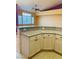 The kitchen island features granite countertop and modern cabinetry at 5048 Orchid Springs St, Las Vegas, NV 89148