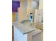 Close-up of kitchen island featuring granite countertop and modern cabinetry at 5048 Orchid Springs St, Las Vegas, NV 89148