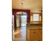 Open kitchen and breakfast nook area with granite countertops and modern appliances at 5048 Orchid Springs St, Las Vegas, NV 89148