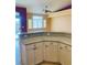 Granite countertop peninsula provides additional counter space in this bright kitchen at 5048 Orchid Springs St, Las Vegas, NV 89148