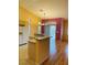 Kitchen features granite island and light wood cabinets at 5048 Orchid Springs St, Las Vegas, NV 89148