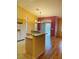 Open-concept kitchen with modern appliances, granite counters, and breakfast bar at 5048 Orchid Springs St, Las Vegas, NV 89148