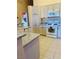 The kitchen features stainless steel appliances, ample cabinet space, and granite countertops at 5048 Orchid Springs St, Las Vegas, NV 89148