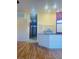 Bright and airy kitchen with stainless steel appliances and wood-style flooring at 5048 Orchid Springs St, Las Vegas, NV 89148