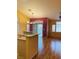 Cozy kitchen area with views of backyard, wood floors, and granite countertops at 5048 Orchid Springs St, Las Vegas, NV 89148