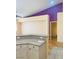 Granite countertop peninsula for seating or food prep in the open-concept kitchen at 5048 Orchid Springs St, Las Vegas, NV 89148