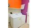 Functional laundry room with washer, dryer, and shelving for storage at 5048 Orchid Springs St, Las Vegas, NV 89148