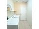Laundry room featuring tile flooring, a white door, washer and dryer at 5048 Orchid Springs St, Las Vegas, NV 89148