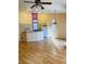 Open-concept living area with wood flooring and natural light, flowing into the kitchen at 5048 Orchid Springs St, Las Vegas, NV 89148