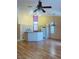 Open-concept kitchen and living space featuring hardwood floors and recessed lighting at 5048 Orchid Springs St, Las Vegas, NV 89148