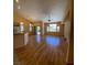Open floor plan with lots of natural light, laminate floors, and neutral colored walls at 5048 Orchid Springs St, Las Vegas, NV 89148