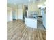 Open concept living room featuring hardwood flooring and eat-in kitchen at 5048 Orchid Springs St, Las Vegas, NV 89148