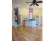 Bright living space with hardwood floors and open layout to the kitchen and entryway at 5048 Orchid Springs St, Las Vegas, NV 89148