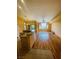 Spacious living room featuring hardwood flooring, large windows, and fan at 5048 Orchid Springs St, Las Vegas, NV 89148