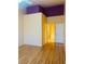 Comfortable bedroom with wood floors and ensuite bathroom with a tub and shower at 5048 Orchid Springs St, Las Vegas, NV 89148