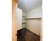 A walk-in closet with carpeted flooring and built-in metal racks for hanging clothing at 5048 Orchid Springs St, Las Vegas, NV 89148