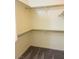 A walk-in closet with shelving and neutral carpeting at 5048 Orchid Springs St, Las Vegas, NV 89148
