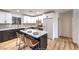 Modern kitchen with white and dark cabinets, quartz countertops, and stainless steel appliances at 7910 Firethorn Ln, Las Vegas, NV 89123