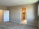 Bedroom featuring neutral walls, carpet, and a view to a closet space at 11467 Monte Isola St, Las Vegas, NV 89141