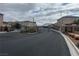 Gated community entrance featuring black metal gates and brick pillars at 11467 Monte Isola St, Las Vegas, NV 89141