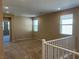 Spacious upstairs landing area with carpet, neutral walls, and multiple windows at 11467 Monte Isola St, Las Vegas, NV 89141