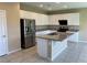 Bright kitchen featuring stainless steel appliances, granite counters, and white cabinets at 11467 Monte Isola St, Las Vegas, NV 89141